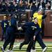 Maize Team player Patrick Olszewski bobbles the ball during the alumni spring flag football game on Saturday, April 13. AnnArbor.com I Daniel Brenner